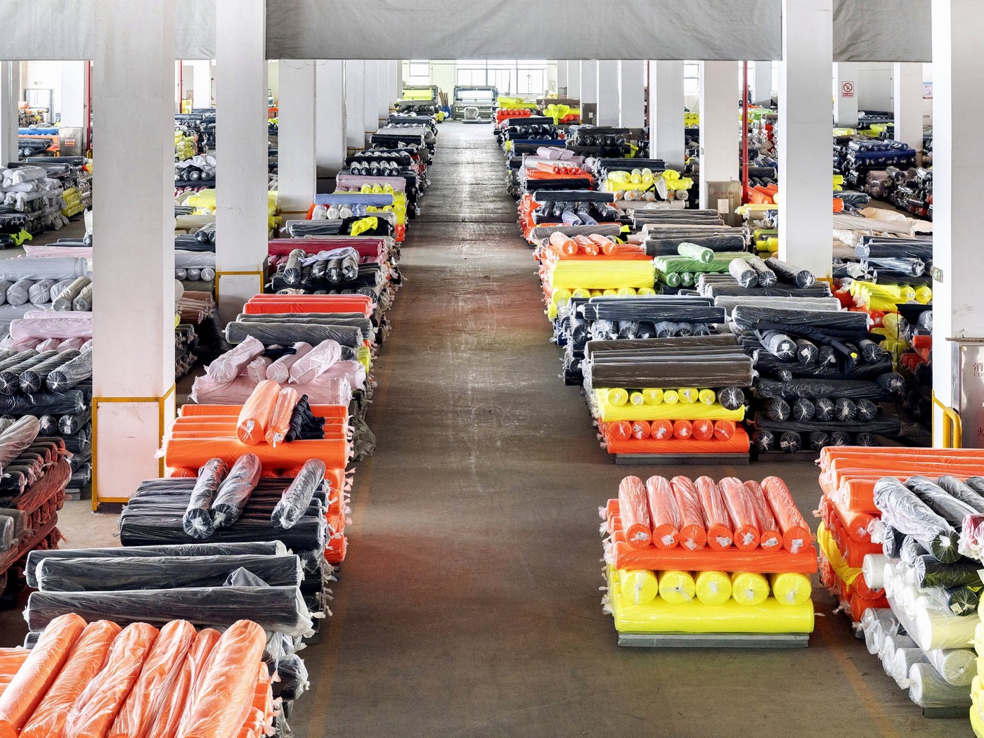 Changshu Huamao Textile warehouse with high-visibility fabric rolls