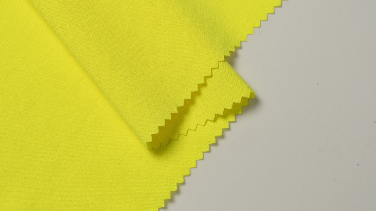 HM054 fluorescent yellow stretch fabric surface and folded detail