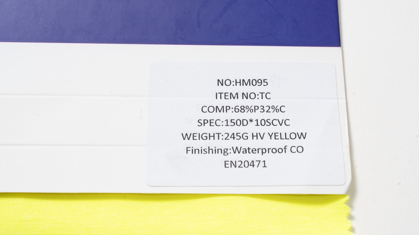 HM095 actual yellow fabric sample and catalogue label